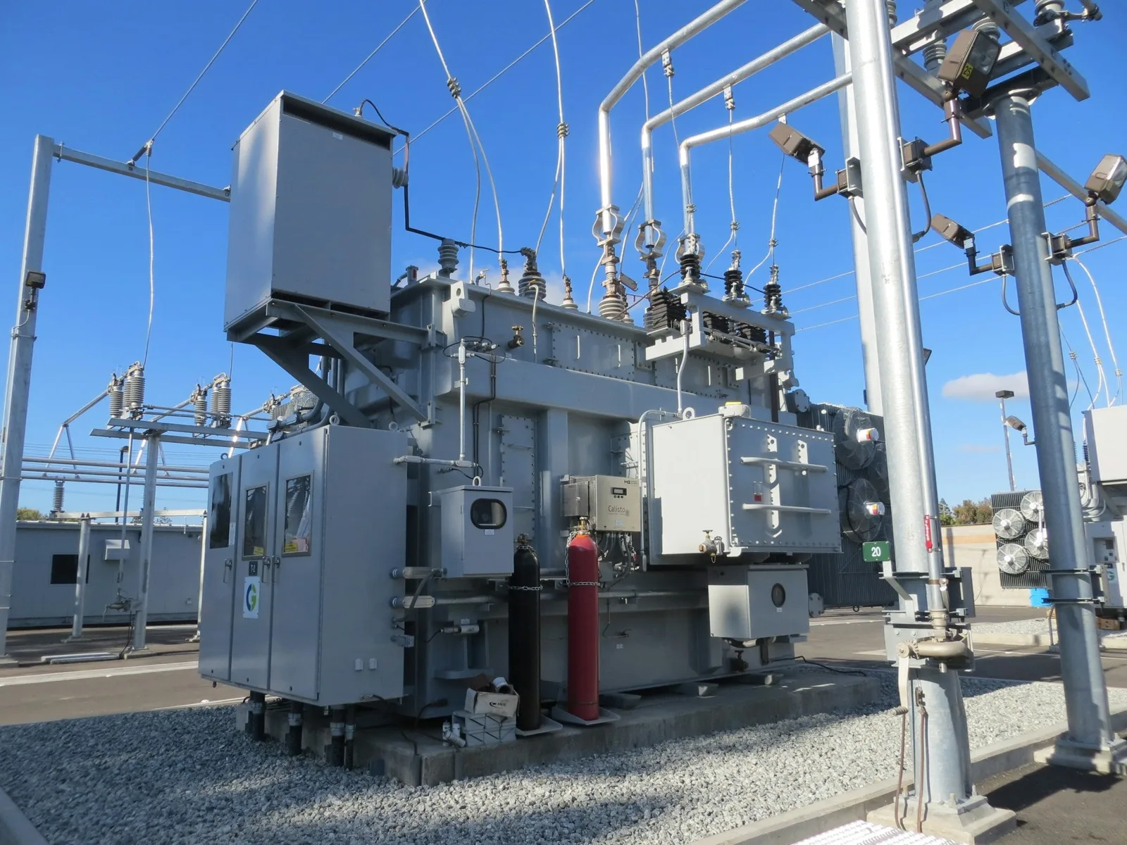 Power transformer in a substation under a blue sky