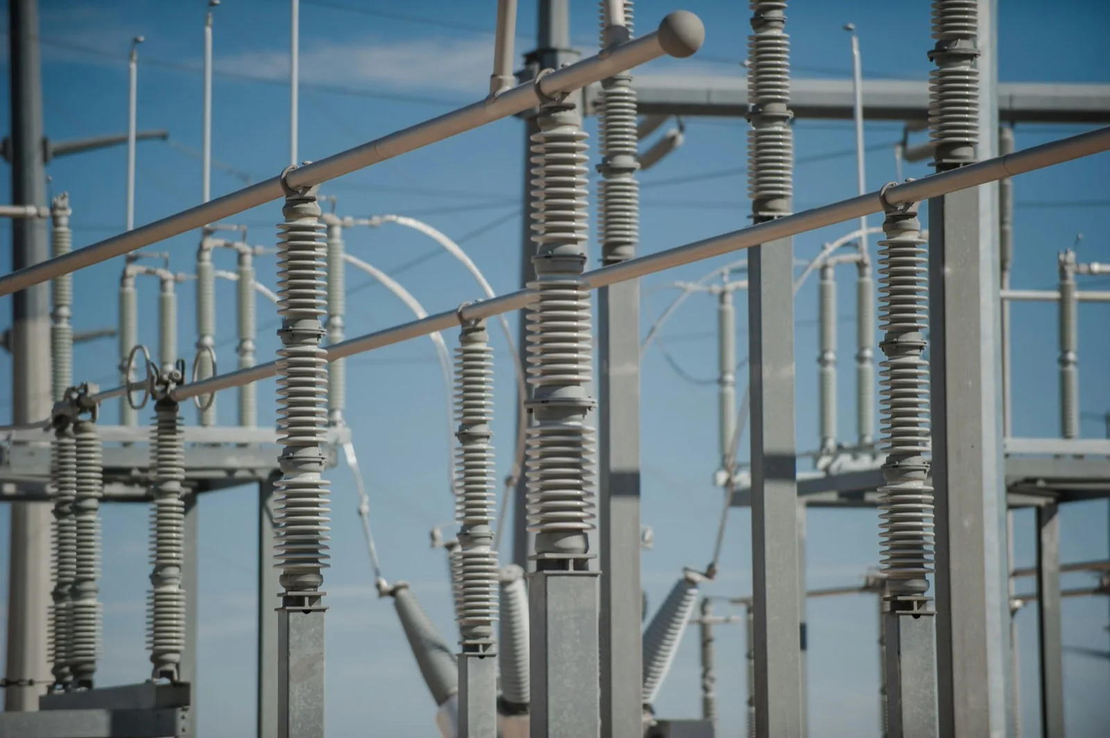 High-voltage insulators and disconnect switches on a galvanized structure