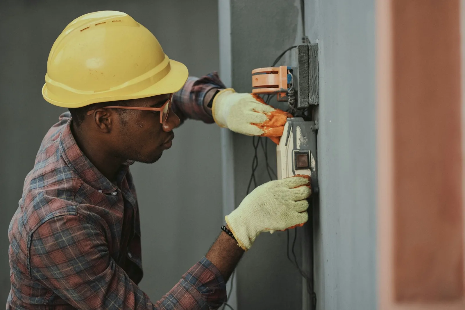 Electrician installing a box on a wall